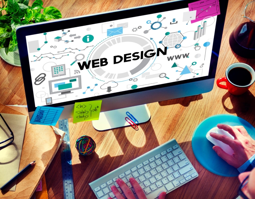 Small Business Web Design Services with computer screen and keyboard in office photo